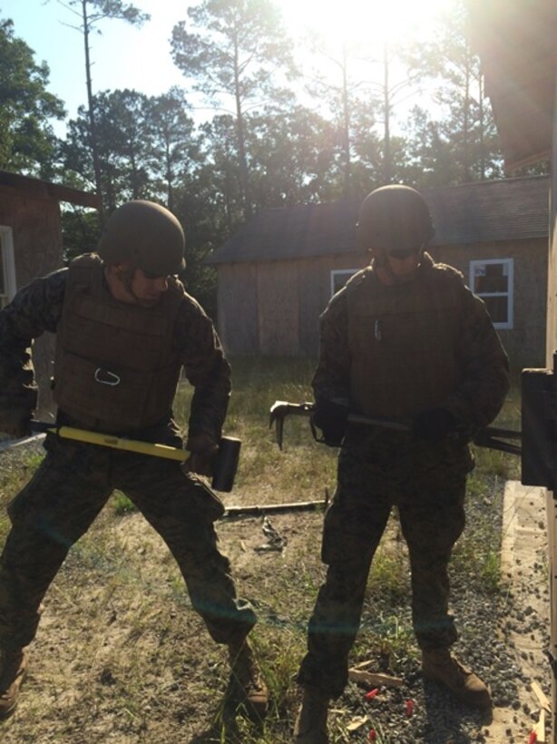 On June 3, 2016 Marine Officers attached to Combat Engineer Officer course 5-16 (CEO 5-16) learn how to conduct a variety of mechanical breaches. These breaching methods provide Marines with the means to enter locked and barricaded buildings, a key job of a Combat Engineer. Pictured from left to right are Second Lieutenants Justin Wilkison and Thomas Cofer.  
