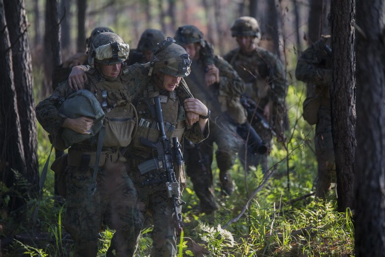 Marines with 3rd Battalion, 6th Marine Regiment buddy carry their wounded off of the battlefield during an objective raid at Camp Lejeune, N.C., June 9, 2016. The battalion conducted a Marine Corps Combat Readiness Evaluation from June 6-10 in preparation for an upcoming deployment.