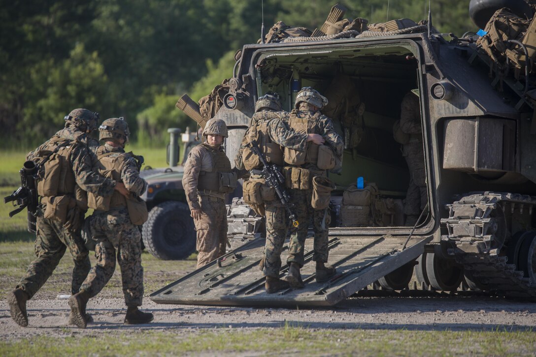 Marines with 3rd Battalion, 6th Marine Regiment rally their wounded into the back of an amphibious assault vehicle during a raid at Camp Lejeune, N.C., June 9, 2016. Throughout the week, the battalion was tested on their operational readiness as part of the Marine Corps Combat Readiness Evaluation.