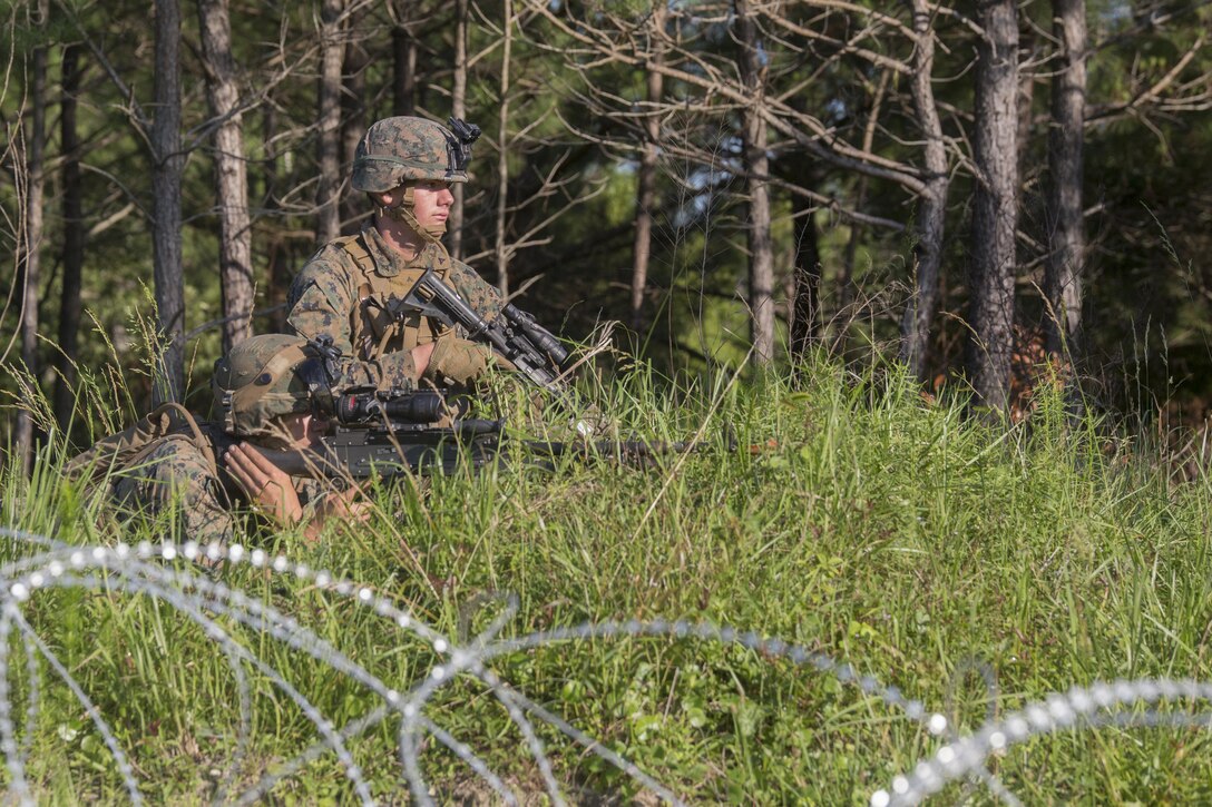Private First Class Casin Mullinex and Lance Cpl. Shaun Carnley, machine gunners with 3rd Battalion, 6th Marine Regiment, set up defensive security after capturing Landing Zone Cardinal from the enemy during the final raid of the Marine Corps Combat Readiness Evaluation at Camp Lejeune, N.C., June 9, 2016. The MCCRE tests the Marines on their ability to operate as a whole and is the final exercise as a battalion during pre-deployment training.
