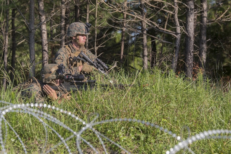 Private First Class Casin Mullinex and Lance Cpl. Shaun Carnley, machine gunners with 3rd Battalion, 6th Marine Regiment, set up defensive security after capturing Landing Zone Cardinal from the enemy during the final raid of the Marine Corps Combat Readiness Evaluation at Camp Lejeune, N.C., June 9, 2016. The MCCRE tests the Marines on their ability to operate as a whole and is the final exercise as a battalion during pre-deployment training.