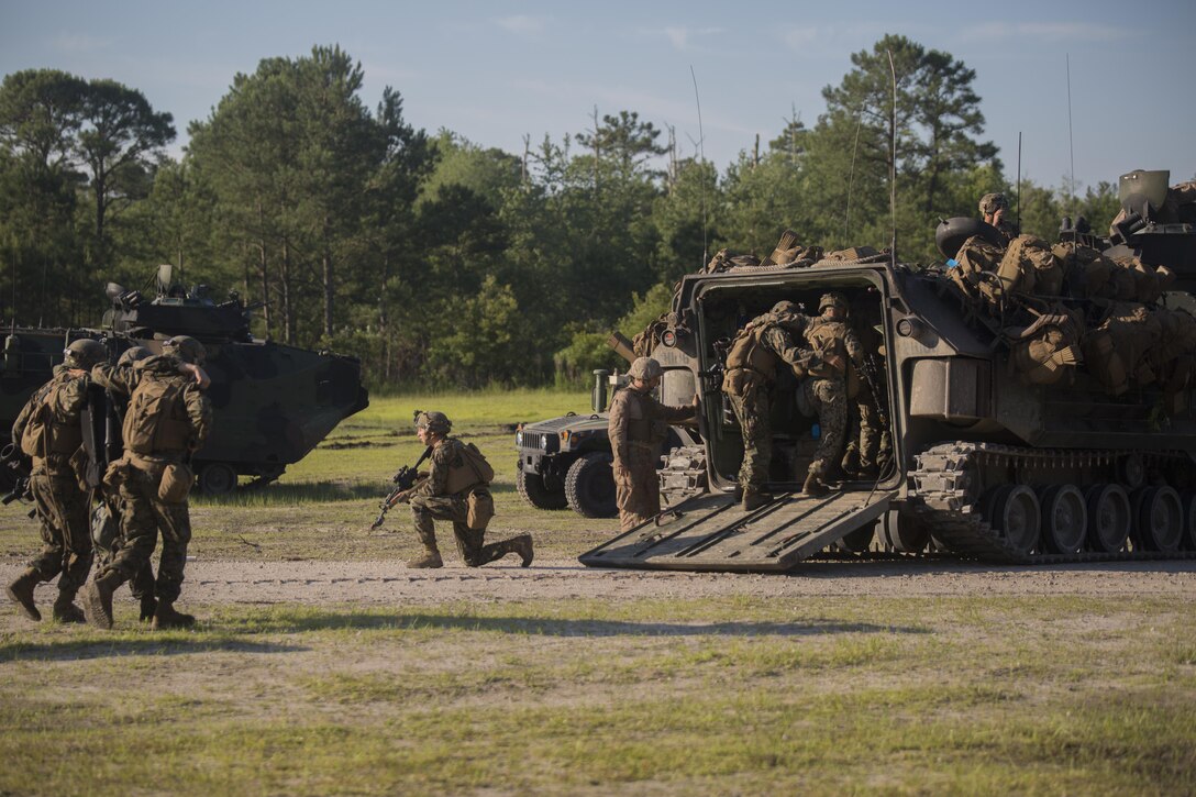 Marines with 3rd Battalion, 6th Marine Regiment buddy carry their wounded off of the battlefield during an objective raid at Camp Lejeune, N.C., June 9, 2016. The battalion conducted a Marine Corps Combat Readiness Evaluation from June 6-10 in preparation for an upcoming deployment.