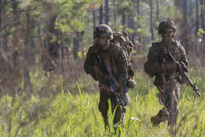 Marines with Kilo Company, 3rd Battalion, 6th Marine Regiment buddy rush the objective at Landing Zone Cardinal at Camp Lejeune, N.C., June 10, 2016. The battalion conducted a Marine Corps Combat Readiness Evaluation in preparation for the upcoming 24th Marine Expeditionary Unit slated in early 2017.
