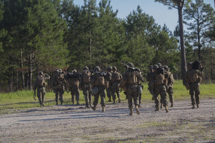 Marines with 3rd Battalion, 6th Marine Regiment consolidate after conducting an objective raid at Landing Zone Cardinal at Camp Lejeune, N.C., June 10, 2016. The battalion conducted a Marine Corps Combat Readiness Evaluation from June 6-10 in preparation for an upcoming deployment. The MCCRE, a week-long evaluation exercise, tests the Marines on operation readiness in a deployed environment.