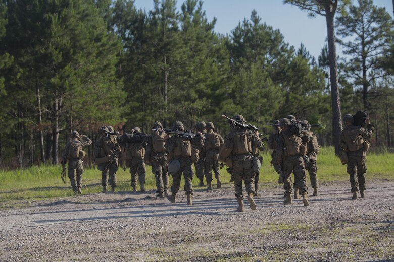 Marines with 3rd Battalion, 6th Marine Regiment consolidate after conducting an objective raid at Landing Zone Cardinal at Camp Lejeune, N.C., June 10, 2016. The battalion conducted a Marine Corps Combat Readiness Evaluation from June 6-10 in preparation for an upcoming deployment. The MCCRE, a week-long evaluation exercise, tests the Marines on operation readiness in a deployed environment.