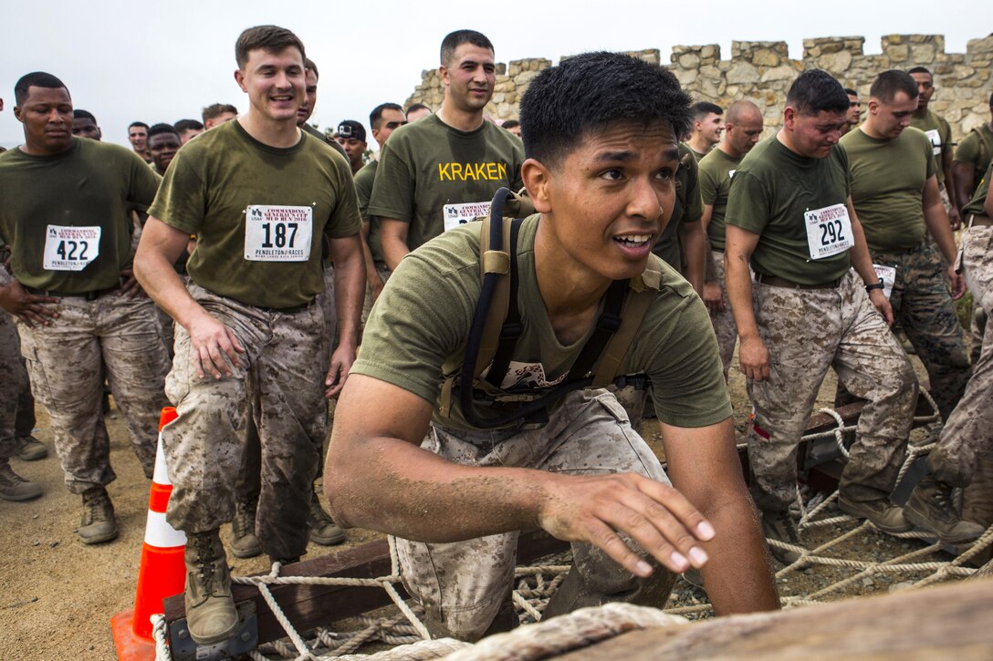 Marines and sailors participate in the 2016 World Famous Mud Run by Lake O'Neill at Camp Pendleton, Calif., June 3, 2016. Marine Corps photo by Cpl. Travis Jordan