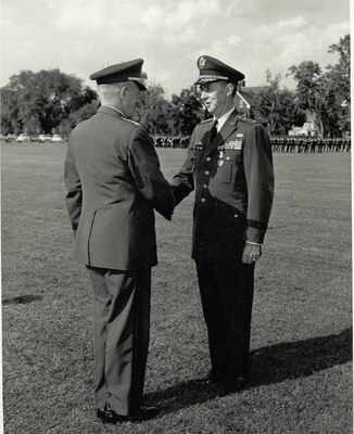 GEN Harold K. Johnson, Chief of Staff, US Army, congratulates Lt. Gen. Alva Fitch, Deputy Director, DIA, after presenting him the Distinguished Service Medal during a retirement ceremony held in his honor.  31 May 1966, Ft. Myer, VA.
