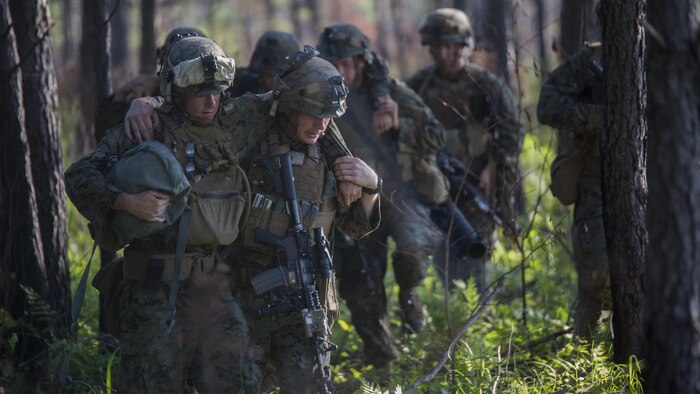 Marines with 3rd Battalion, 6th Marine Regiment buddy carry their wounded off of the battlefield during an objective raid at Marine Corps Base Camp Lejeune, North Carolina, June 9, 2016. The battalion conducted a Marine Corps Combat Readiness Evaluation from June 6-10 in preparation for an upcoming deployment.
