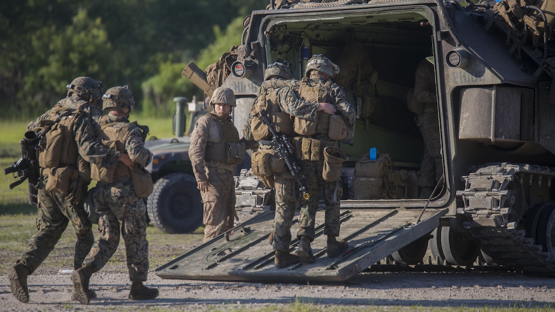 Marines with 3rd Battalion, 6th Marine Regiment rally their wounded into the back of an amphibious assault vehicle during a raid at Marine Corps Base Camp Lejeune, North Carolina, June 9, 2016. Throughout the week, the battalion was tested on their operational readiness as part of the Marine Corps Combat Readiness Evaluation.