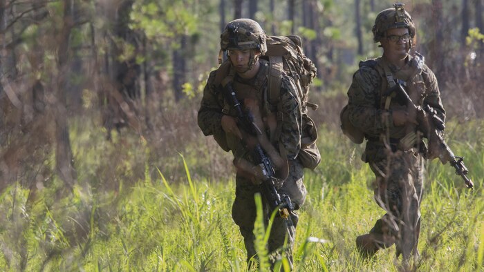 Marines with Kilo Company, 3rd Battalion, 6th Marine Regiment buddy rush the objective at Landing Zone Cardinal at Marine Corps Base Camp Lejeune, North Carolina, June 10, 2016. The battalion conducted a Marine Corps Combat Readiness Evaluation in preparation for the upcoming 24th Marine Expeditionary Unit slated in early 2017.