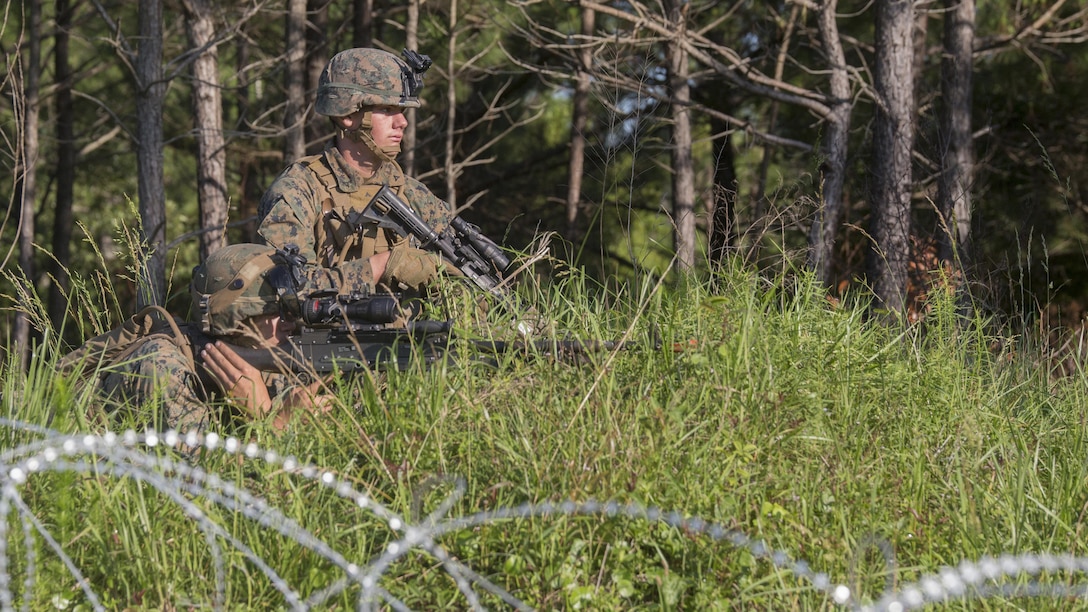 Private First Class Casin Mullinex and Lance Cpl. Shaun Carnley, machine gunners with 3rd Battalion, 6th Marine Regiment, set up defensive security after capturing Landing Zone Cardinal from the enemy during the final raid of the Marine Corps Combat Readiness Evaluation at Marine Corps Base Camp Lejeune, North Carolina, June 9, 2016. The MCCRE tests the Marines on their ability to operate as a whole and is the final exercise as a battalion during pre-deployment training.
