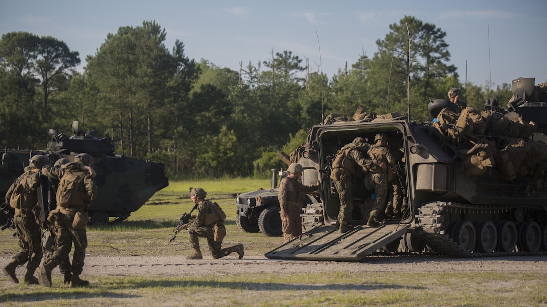 Marines with 3rd Battalion, 6th Marine Regiment buddy carry their wounded off of the battlefield during an objective raid at Marine Corps Base Camp Lejeune, North Carolina, June 9, 2016. The battalion conducted a Marine Corps Combat Readiness Evaluation from June 6-10 in preparation for an upcoming deployment.
