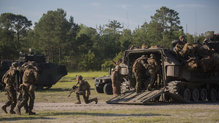 Marines with 3rd Battalion, 6th Marine Regiment buddy carry their wounded off of the battlefield during an objective raid at Marine Corps Base Camp Lejeune, North Carolina, June 9, 2016. The battalion conducted a Marine Corps Combat Readiness Evaluation from June 6-10 in preparation for an upcoming deployment.