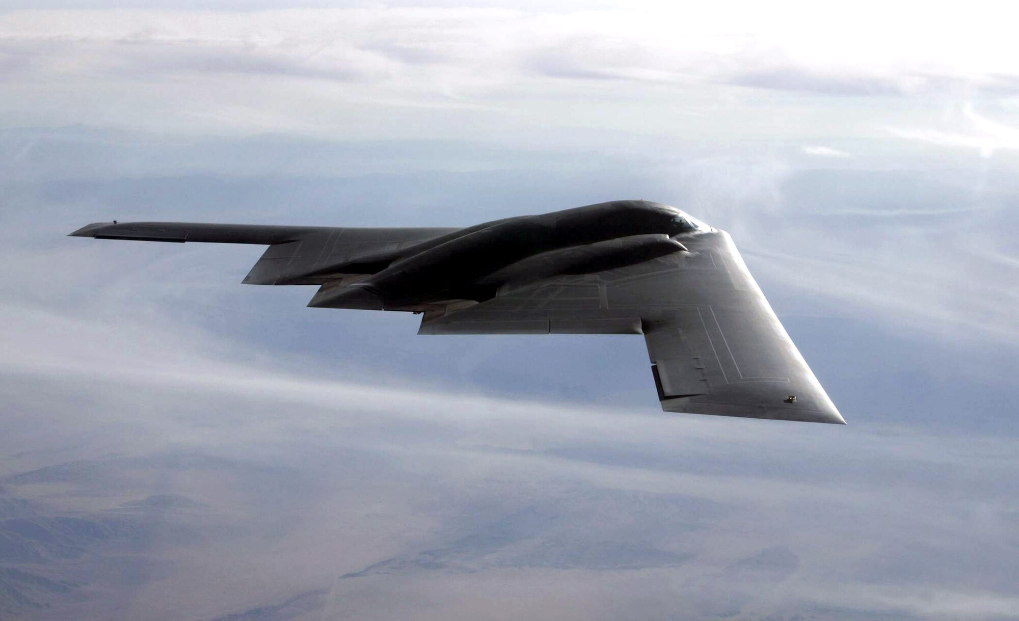 The B-2A Spirit flies over the Utah Testing and Training Range in 2003 at Hill Air Force Base. (U.S. Air Force photo/Photo by Bobbie Garcia)