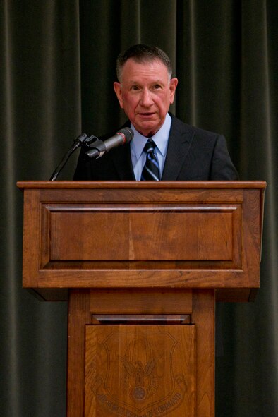 Retired U.S. Air Force Col. Dan Coker, reflects on the career of U.S. Air Force Reserve Chief Master Sgt. Tim Taylor, quality assurance representative, 913th Maintenance Squadron, during his retirement ceremony at Little Rock Air Force Base, Ark., June 11, 2016. Taylor retired after 36 years of faithful service to his country in a room filled with family, friends and co-workers. (U.S. Air Force photo by Master Sgt. Jeff Walston/Released)     