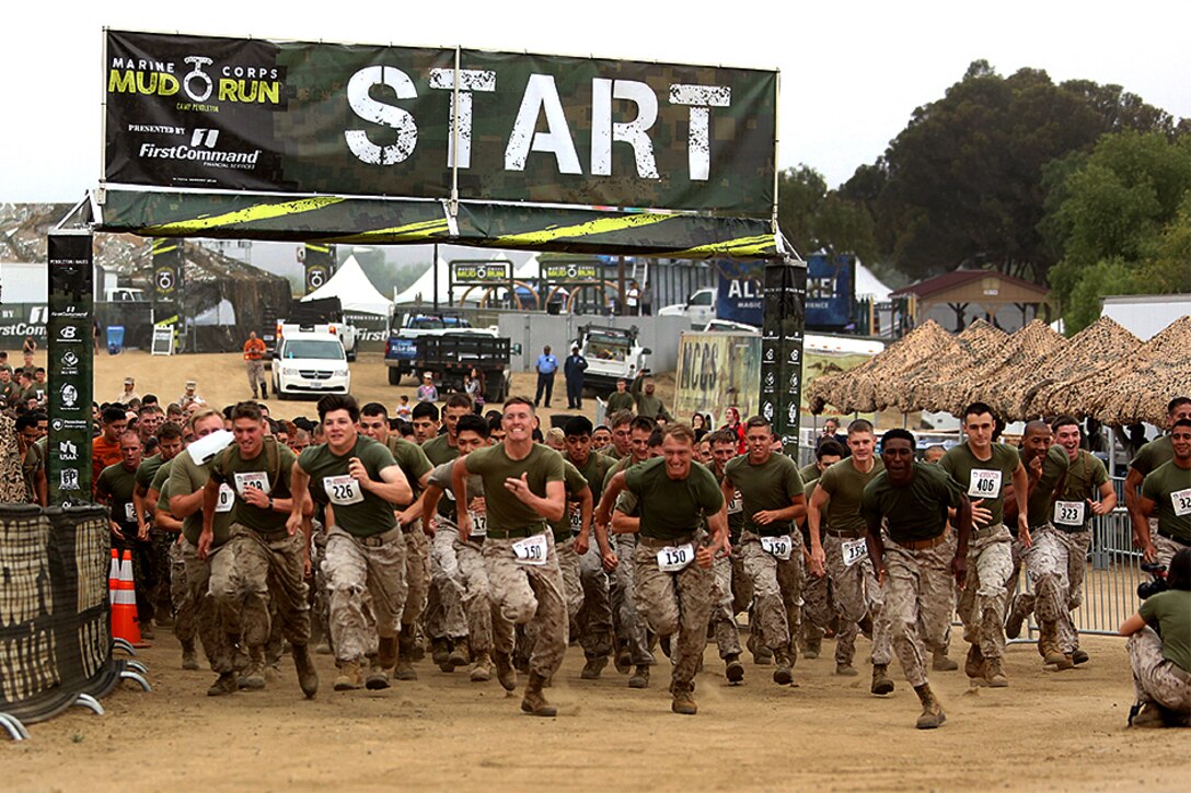 Marines and sailors participate in the Commanding General's Cup Run during the 2016 World Famous Mud Run by Lake O'Neill at Camp Pendleton, Calif., June 3, 2016. The race covered about 6.5 miles and obstacles such as several mud pits, an ammo can run, and a mud wall. Marine Corps photo by Pfc. Liah Kitchen