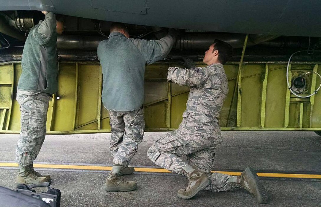 A Maintenance Repair Team consisting of Airmen assigned to the 22nd Aircraft Maintenance Squadron and 931st AMXS repair a KC-135 Stratotanker, May 18, 2016, at Joint Base Lewis-McChord, Wash. MRTs travel to different bases to respond to aircraft that are off-station and not fit to fly. (Courtesy photo)