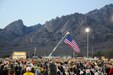 The U.S. flag is raised at dawn in White Sands Missile Range, NM, March 22, 2016 to mark the beginning of the 26.2-mile Bataan Death March.  The Bataan Death march is conducted in honor of the heroic service members who defended the Philippine Islands during World War II.(Photo courtesy of MARATHONFOTO.)