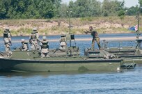 A Dutch soldier on a Bridge Erection Boat gives Soldiers from the 361st Engineer Company out of Warner Robins, Ga., some tips on how to maneuver the Improved Ribbon Bridge during bridge training on the Vistula River in Chelmno, Poland, as part of Exercise Anakonda 2016. Exercise Anakonda 2016 is a Polish-led, joint, multinational exercise taking place in Poland from June 7-17. This exercise involves more than 31,000 participants from more than 20 nations. Exercise Anakonda 2016 is a premier training event for U.S. Army Europe and participating nations and demonstrates that the U.S. and partner nations can effectively unite together under a unified command while training on a contemporary scenario.