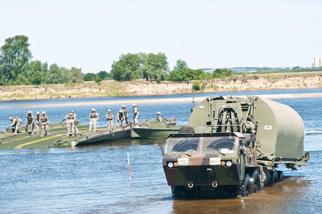Soldiers of the 361st Engineer Company from Warner Robins, Ga., sharpen their skills by constructing the Improved Ribbon Bridge on the Vistula River in Chelmno, Poland, as a part of Exercise Anakonda 2016. The IRB is a sectional floating bridge that can be used to create a full bridge or to ferry vehicles and equipment across a body of water. Exercise Anakonda 2016 is a Polish-led, joint, multinational exercise taking place in Poland from June 7-17. This exercise involves more than 31,000 participants from more than 20 nations. Exercise Anakonda 2016 is a premier training event for U.S. Army Europe and participating nations and demonstrates that the U.S. and partner nations can effectively unite together under a unified command while training on a contemporary scenario.