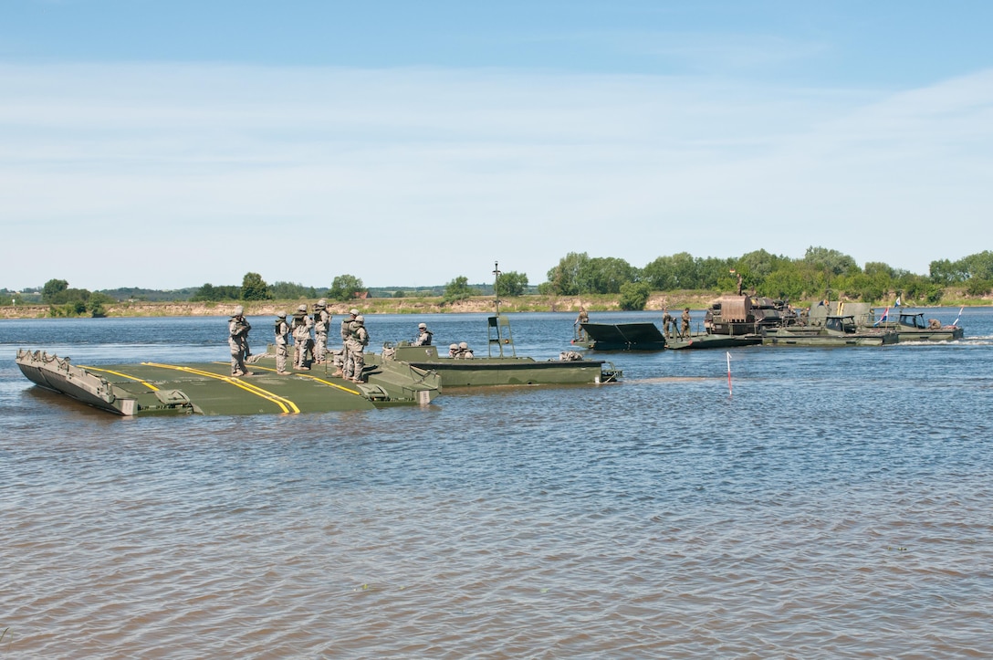 Soldiers of the 361st Engineer Company from Warner Robins, Ga., hone their skills on the Improved Ribbon Bridge on the Vistula River in Chelmno, Poland, alongside engineer elements from the German and Dutch armies as a part of Exercise Anakonda 2016. Exercise Anakonda 2016 is a Polish-led, joint, multinational exercise taking place in Poland from June 7-17. This exercise involves more than 31,000 participants from more than 20 nations. Exercise Anakonda 2016 is a premier training event for U.S. Army Europe and participating nations and demonstrates that the U.S. and partner nations can effectively unite together under a unified command while training on a contemporary scenario.