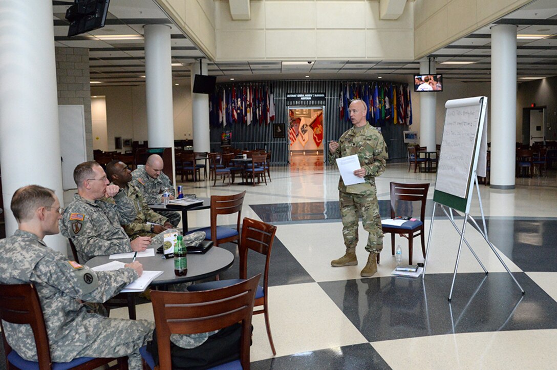 Army Lt. Col. Bryan Brokate, DLA JRF Deputy Commanding Officer, speaks to other JRF leaders during the Combined Drill Weekend June 11 at the McNamara Headquarters Complex, Fort Belvoir. Virginia. Participants from throughout DLA attended, which focused on readiness, training and operational support to DLA.