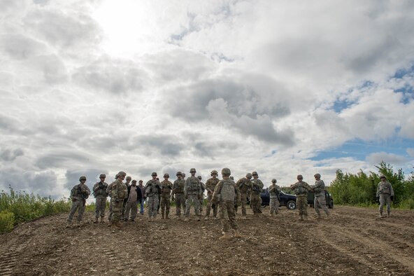 U.S. Army Soldiers from the 1st Battalion, 24th Infantry Regiment at Fort Wainwright, Alaska, talk through completed and future operations June 8, 2016, while operating in the Joint Pacific Alaska Range Complex during RED FLAG-Alaska (RF-A) 16-2. RF-A enables joint and international units to sharpen their combat skills by flying simulated combat sorties in a realistic threat environment, which allows them to exchange tactics, techniques and procedures while improving interoperability. (U.S. Air Force photo by Staff Sgt. Shawn Nickel/Released)