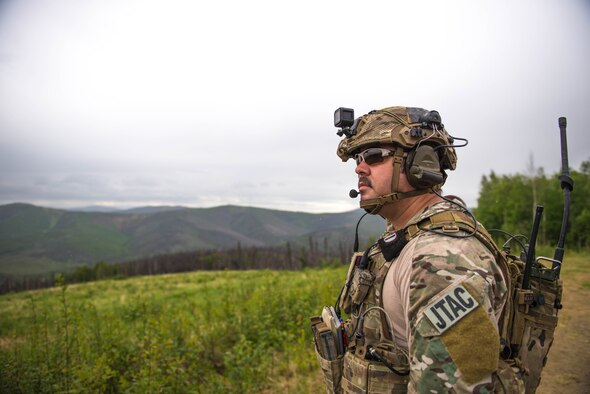 U.S. Air Force Staff Sgt. Jacob Rinker, a 13th Air Special Operations Squadron joint terminal attack controller out of Fort Carson, Colo., coordinates close air support for U.S. Soldiers in the Joint Pacific Alaska Training Range, June 8, 2016, during RED FLAG-Alaska 16-2. The exercise provides unique opportunities to integrate various forces into joint, coalition and multilateral training from simulated forward operating bases. (U.S. Air Force photo by Staff Sgt. Shawn Nickel/Released)