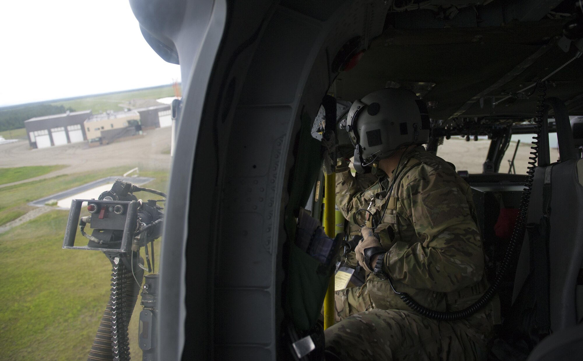 U.S. Airmen assigned to the Alaska Air National Guard’s 210th Rescue Squadron (RQS) Detachment 1 at Eielson Air Force Base, Alaska, prepare for routine training while flying in an HH-60G Pave Hawk combat search and rescue helicopter June 9, 2016, in the Joint Pacific Alaska Range Complex. In addition to providing alert support for Eielson, the 210th RQS also provides assistance to the U.S. Coast Guard, Alaska State Troopers and the National Park Service. (U.S. Air Force photo by Airman Isaac Johnson)