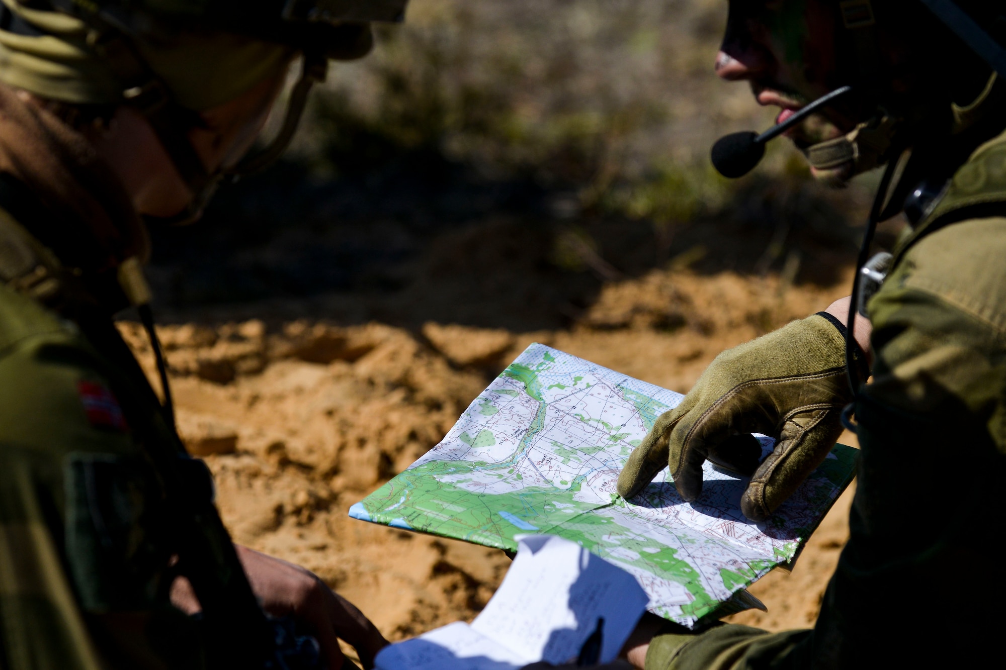 British soldiers review a map before a training exercise June 13, 2016, at Adazi Military Training Base, Latvia.  U.S. forces and NATO partners are in Europe participating in Saber Strike 16; a long-standing, U.S. Joint Chiefs of Staff-directed, U.S. Army Europe-led cooperative-training exercise, which has been conducted annually since 2010.  Our presence in Europe and the relationships built over the past 70 years provide the U.S. strategic access critical to meet our NATO commitment to respond to threats against our allies and partners. (U.S. Air Force photo/Senior Airman Nicole Keim)