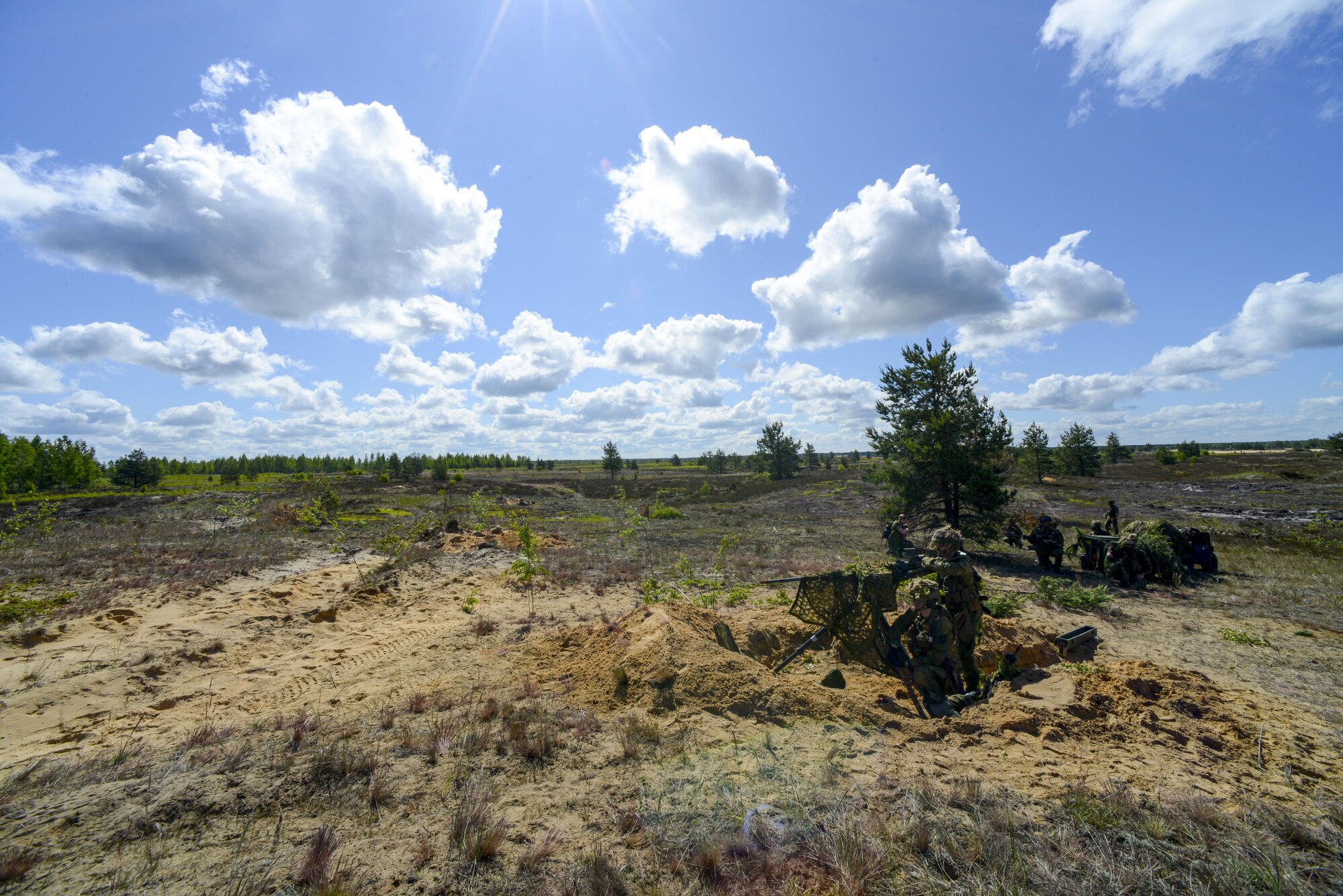 NATO forces await an attack from opposing forces during a training exercise June 13, 2016, at Adazi Military Training Base, Latvia.  U.S. forces and NATO partners are in Europe participating in Saber Strike 16; a long-standing, U.S. Joint Chiefs of Staff-directed, U.S. Army Europe-led cooperative-training exercise, which has been conducted annually since 2010.  SbS16 rapidly deploys personnel across the Baltic region, ensuring allied and partnered nations are able to quickly assemble and train anywhere they are called to do so. (U.S. Air Force photo/Senior Airman Nicole Keim)