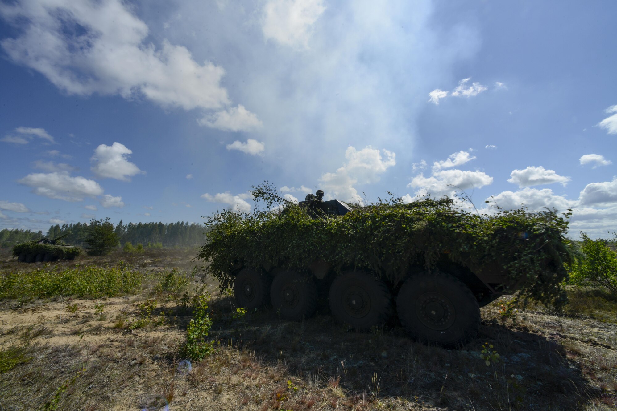 NATO forces drive tanks across a simulated battlefield during a training exercise June 13, 2016, at Adazi Military Training Base, Latvia.  U.S. forces and NATO partners are in Europe participating in Saber Strike 16; a long-standing, U.S. Joint Chiefs of Staff-directed, U.S. Army Europe-led cooperative-training exercise, which has been conducted annually since 2010. Saber Strike rapidly deploys personnel across the Baltic region, ensuring allied and partnered nations are able to quickly assemble and train anywhere they are called to do so. (U.S. Air Force photo/Senior Airman Nicole Keim)
