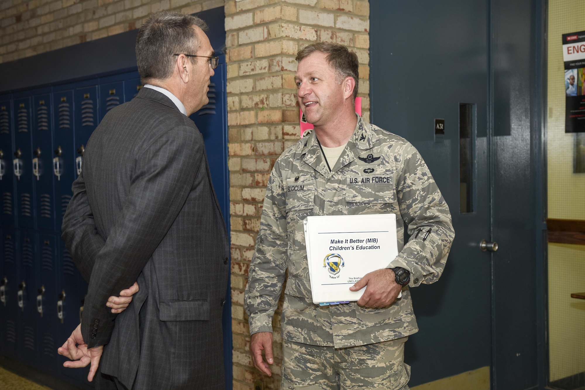 Dr. Michael Dunsmore (left), Wayne County Public Schools superintendent, speaks with Col. Mark Slocum, 4th Fighter Wing commander, during a Wayne County School tour, May 11, 2016, in Goldsboro, North Carolina. Dunsmore and Slocum participated in the Wayne County Education Public Schools tour to show community leaders the condition of the public schools and the impact they’re having on the community. (U.S. Air Force photo by Airman Shawna L. Keyes)    