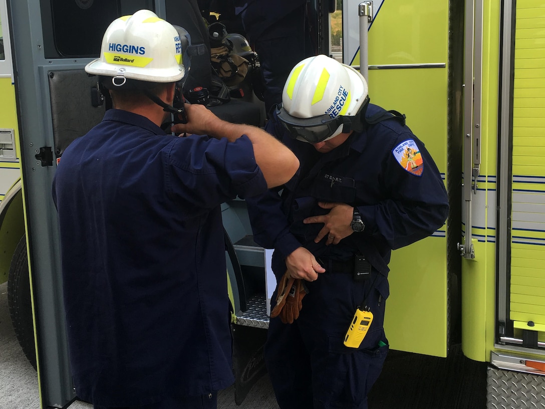 Ashland City fire rescue personnel get their gear on and prepare to participate in a confined space rescue training exercise at the Cheatham Dam Powerhouse in Charlotte, Tenn., May 24, 2016. 