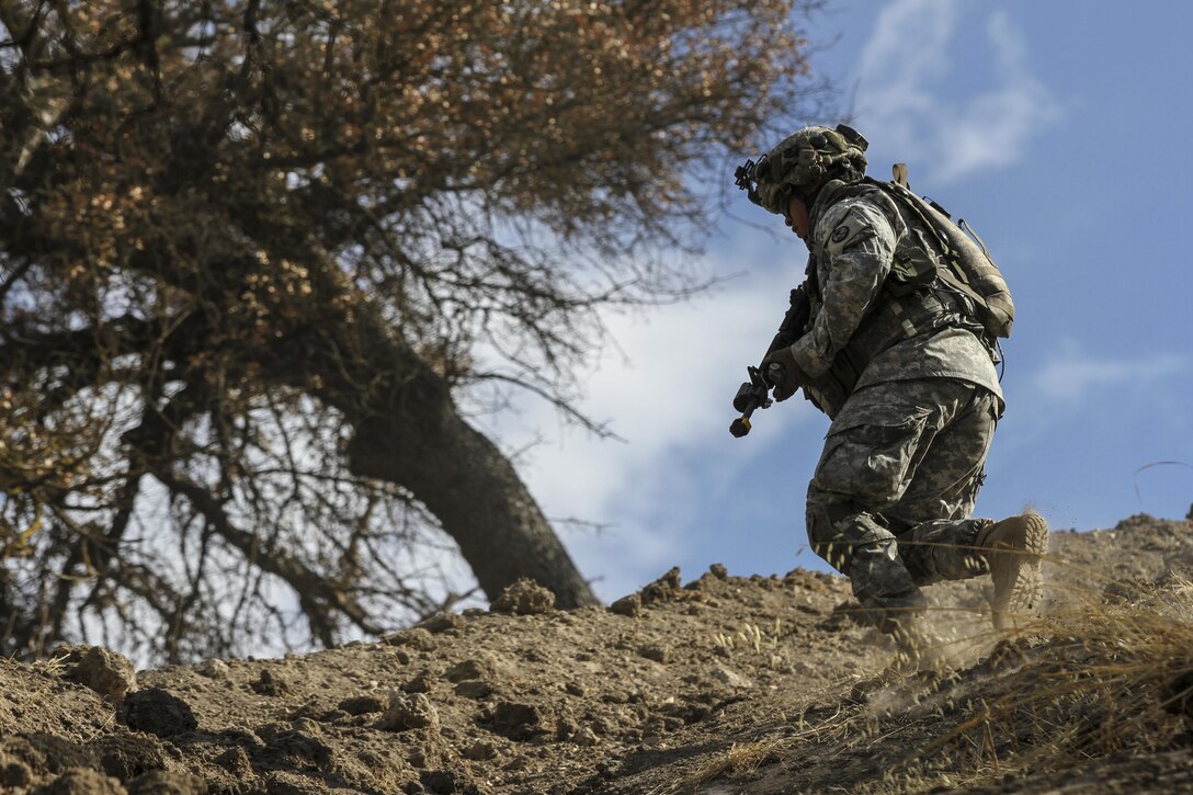 A soldier rushes uphill to a covered zone at Camp Roberts, Calif., June 11, 2016, during 2016 Explorable Combat Training Capability. The soldier is assigned to the Guam Army National Guard’s Company B, 1st Battalion, 294th Infantry Regiment. Army National Guard photo by Staff Sgt. Eddie Siguenza