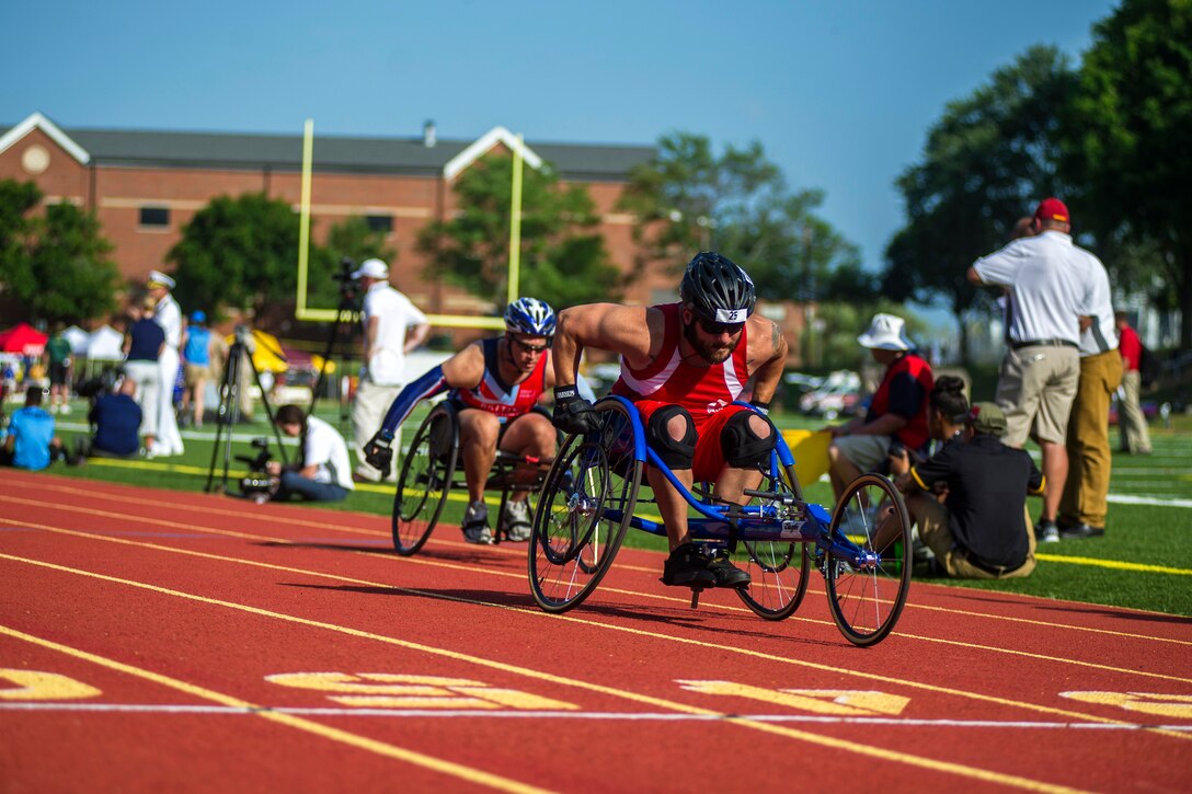 Members of Team British Armed Forces and Team Marines participate in a cycling event during the 2015 DoD Warrior Games at Butler Stadium, Marine Corps Base Quantico, Va., June 23, 2015. Marine Corps photo by Lance Cpl. Terry W. Miller Jr.