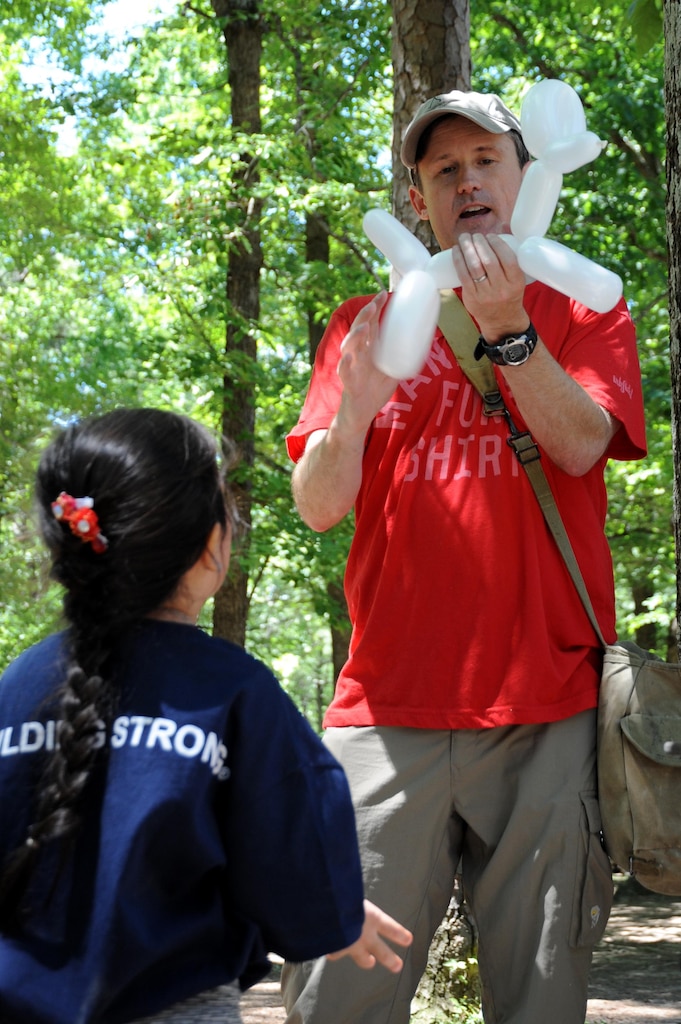 Matthew Urbanic, a Huntsville Center contracting officer, makes balloon animals.
