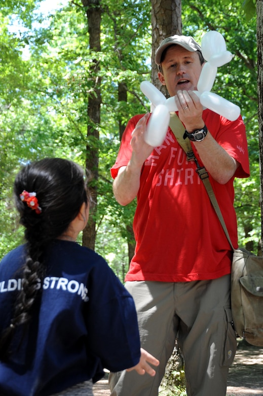 Matthew Urbanic, a Huntsville Center contracting officer, makes balloon animals.
