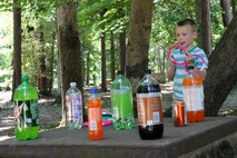 Nicklaus Sunstrom, 5 1/2, prepares for the ring toss, one of several children's activities at Huntsville Center's Organization Day.
