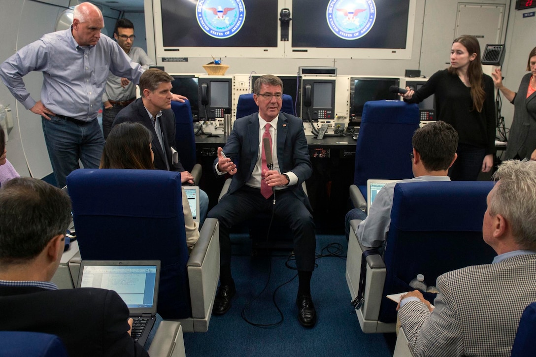 Defense Secretary Ash Carter speaks with reporters aboard a military aircraft as they fly to Brussels, June 13, 2016, to attend a NATO meeting of defense ministers. DoD photo by Air Force Senior Master Sgt. Adrian Cadiz