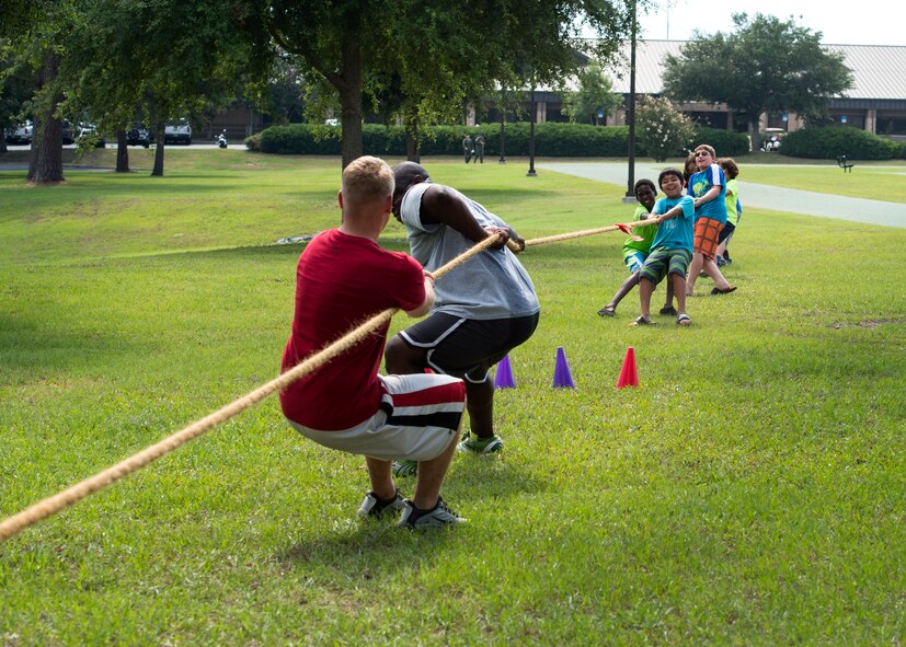 Children from Moody’s Youth Programs try to defeat volunteers during Olympic Day, June 10, 2016, at Moody Air Force Base, Ga. Around the world, more than 160 countries take part in the annual celebration of Olympic Day. (U.S. Air Force photo by Airman 1st Class Janiqua P. Robinson/Released)