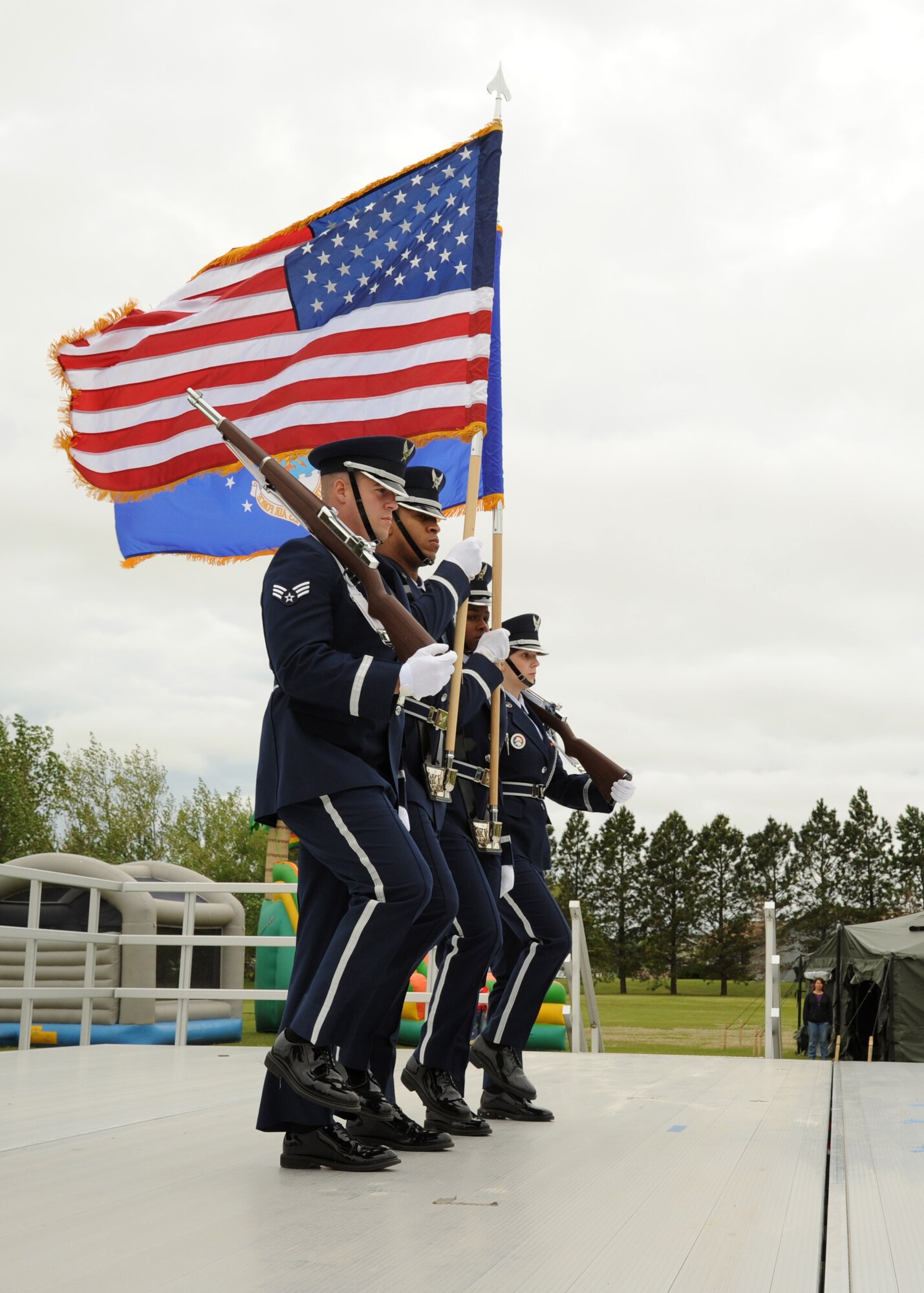 The 319th Air Base Wing Honor Guard presents the colors June 11, 2016, on Cavalier Air Force Station, N.D. The presentation of the colors marked the official beginning of the Cavalier AFS Open House. (U.S. Air Force photo by Senior Airman Ryan Sparks/Released)