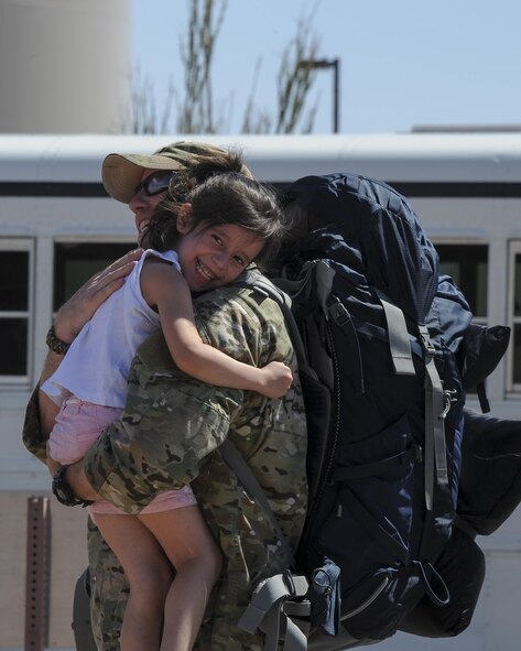 U.S. Air Force Tech. Sgt. Paul, assigned to the 48th Rescue Squadron, greets his daughter after returning home from a 4-month-long deployment at Davis-Monthan Air Force Base, Ariz., June 8, 2016. Two of the three 48th RQS rescue teams, as well as a support team, returned back from a 4-month-long deployment to Turkey. (U.S. Air Force photo by Airman 1st Class Mya M. Crosby/Released)