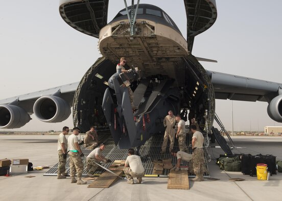 A HH-60G Pave Hawk is off-loaded from a C-5M Super Galaxy on May 30, 2016, at Camp Lemonnier, Djibouti. The C-5M is the largest outsized cargo transport aircraft operated by the U.S. Air Force. (U.S. Air Force photo/Senior Airman Zachary Cacicia)