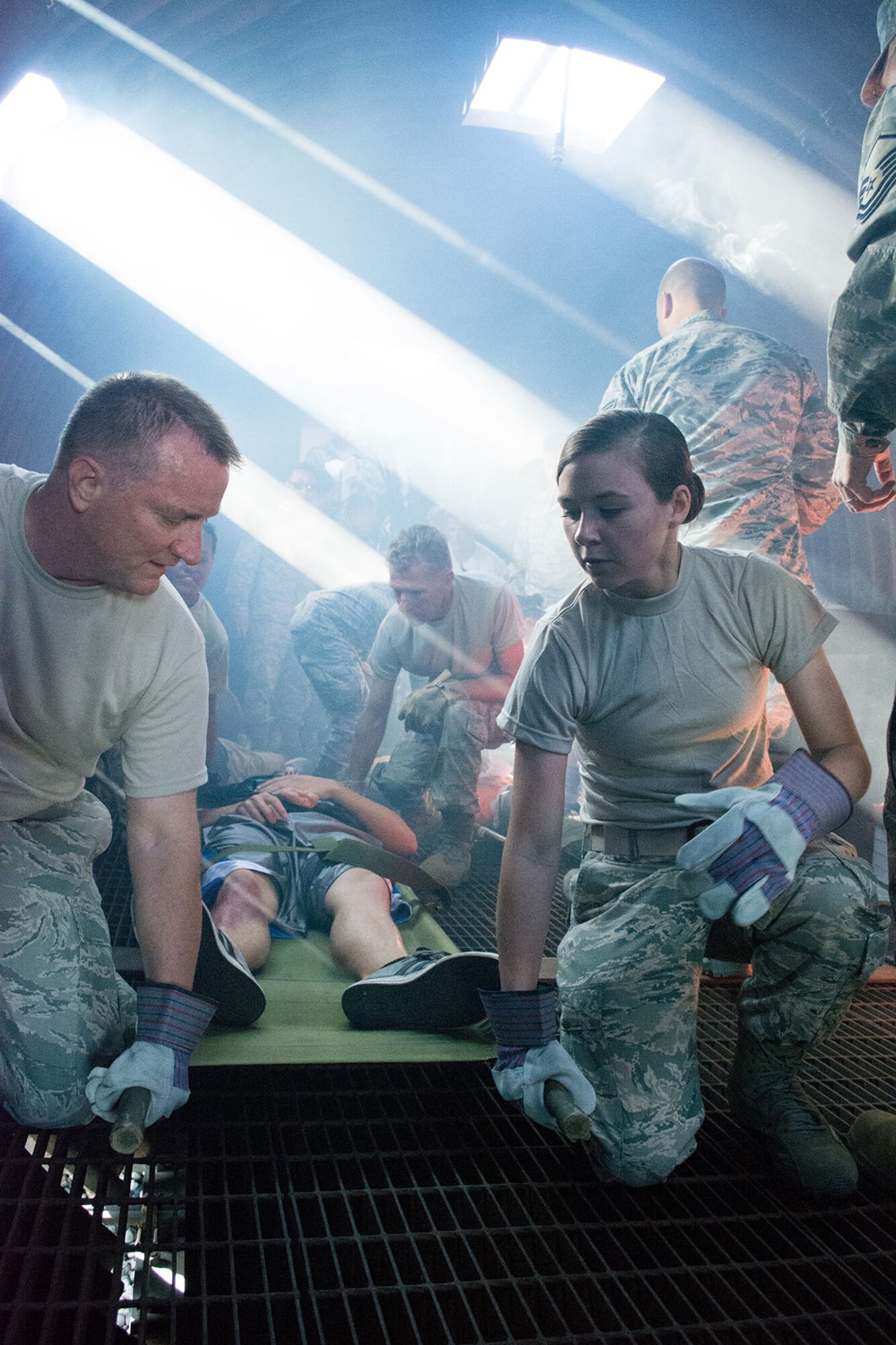 Tech. Sgt. Jared Walker and Senior Airman Kaitlyn Whalen, 419th Medical Squadron, prepare a “litter carry” during a mass casualty exercise of a downed aircraft. During the scenarios, volunteers wore make-up to simulate injuries and received care from Reserve personnel. (Courtesy photo/Senior Airman Barbara Aguirre) 