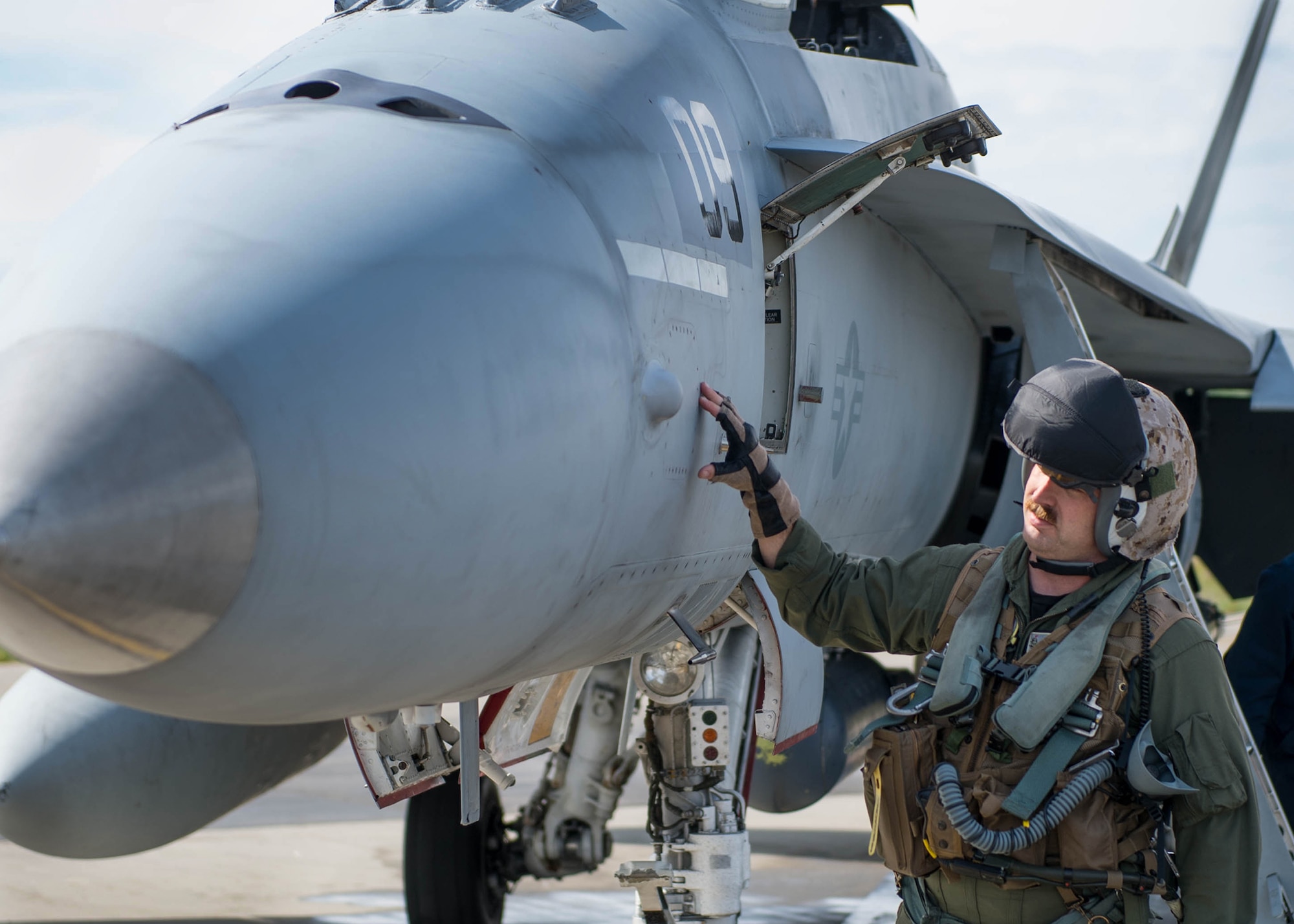 U.S. Marine Corps Stephen Morrison, a Marine Fighter Attack Squadron 314 quality assurance officer, prepares to fly a sortie June 10, 2016, in the number nine jet, which is holds the highest flying hours in the U.S. Marine Corps F-18A Hornet inventory, during RED FLAG-Alaska (RF-A) 16-2. RF-A enables joint and international units to sharpen their combat skills by flying simulated combat sorties in a realistic threat environment, which allows them to exchange tactics, techniques and procedures while improving interoperability. (U.S. Air Force photo by Staff Sgt. Shawn Nickel/Released)

