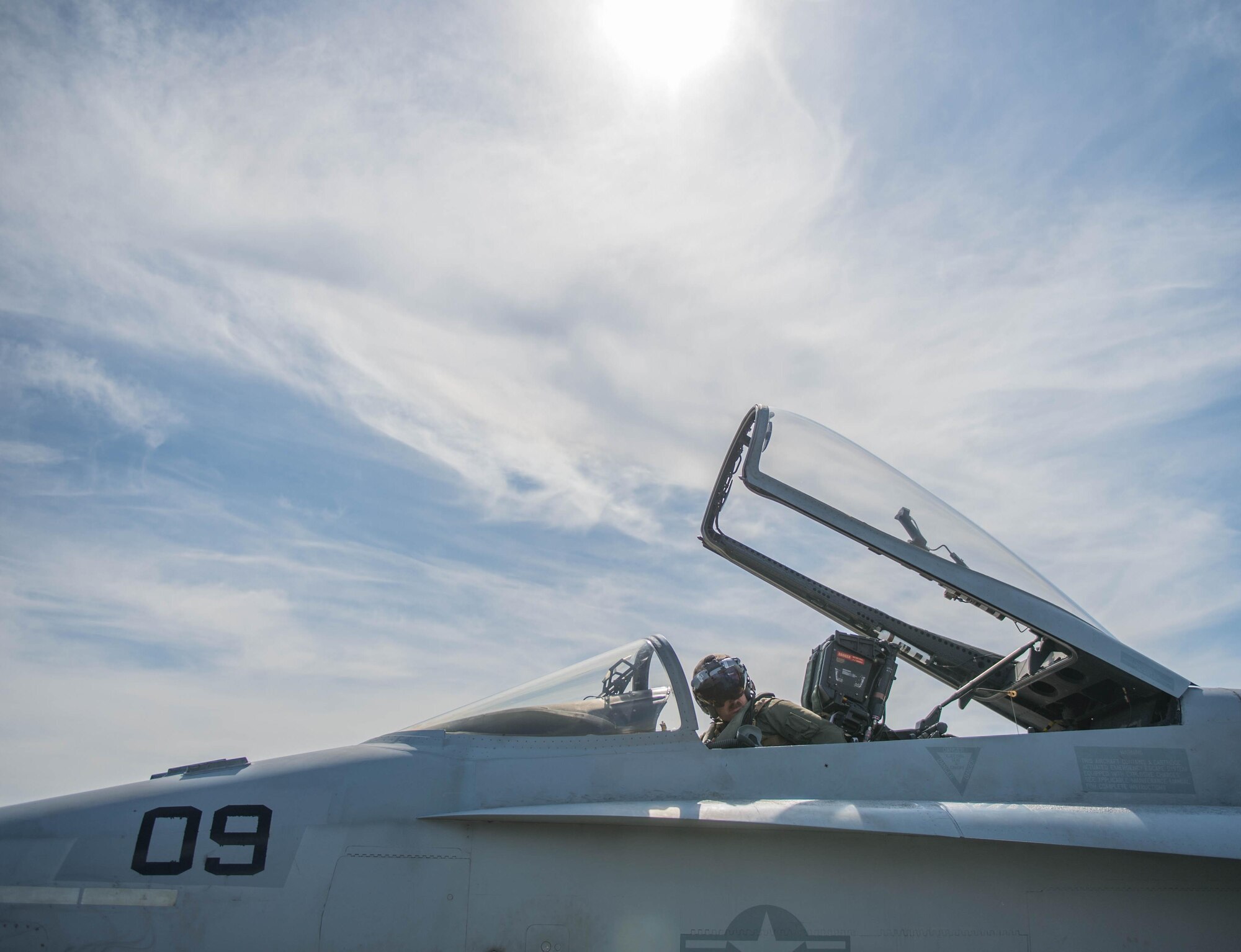 U.S. Marine Corps Stephen Morrison, a Marine Fighter Attack Squadron (VMFA) 314 quality assurance officer, prepares for a June 10, 2016, sortie in the Joint Pacific Alaska Range Complex (JPARC) flying in the number nine jet, which holds the highest flying hours in the U.S. Marine Corps F-18A Hornet inventory, during RED FLAG-Alaska (RF-A) 16-2. The exercise provides unique opportunities to integrate various forces into joint, coalition and multilateral training scenarios from simulated forward operating bases in the JPARC, which at more than 67,000 square miles, is the largest instrumented air, ground and electronic combat training range in the world. (U.S. Air Force photo by Staff Sgt. Shawn Nickel/Released)