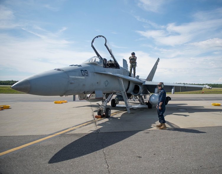 U.S. Marine Corps Stephen Morrison, a Marine Fighter Attack Squadron 314 quality assurance officer, and Lance Cpl. Chance Ison prepare the unit’s number nine jet, which is holds the highest flying hours in the U.S. Marine Corps F-18A Hornet inventory, for a sortie June 10, 2016, during RED FLAG-Alaska 16-2. The exercise provides unique opportunities to integrate various forces into joint, coalition and multilateral training from simulated forward operating bases. (U.S. Air Force photo by Staff Sgt. Shawn Nickel/Released)
