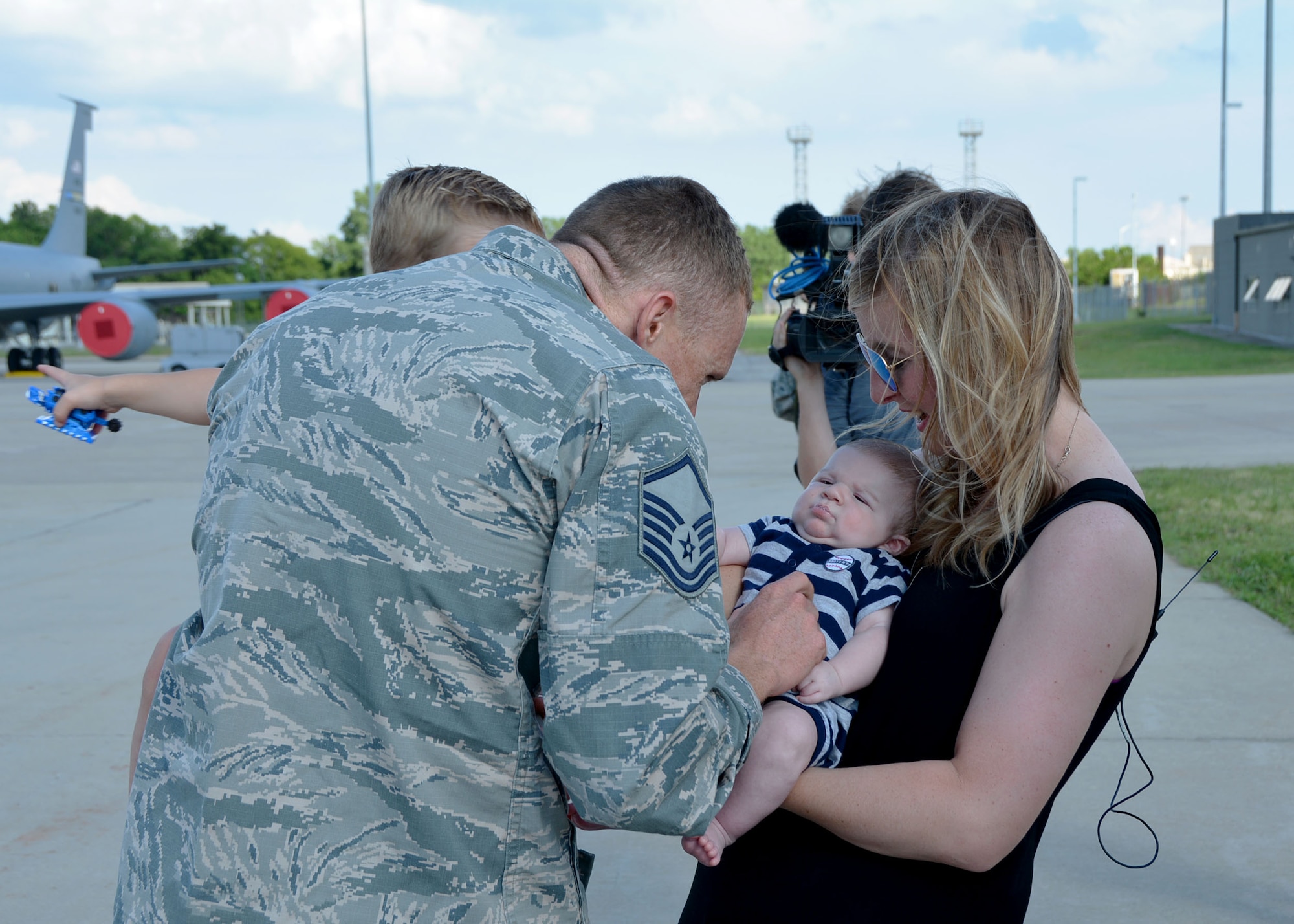 Master Sgt. Robert Mills of the 507th Maintenance Squadron at Tinker Air Force Base, Okla., meets his two-month old son for the first time June 11, 2016, upon his return from a four-month deployment to Southwest Asia. Mills and 12 other Reservists will be granted about a month of leave following deployment, which is integral to the morale and welfare of Airmen and families. (U.S. Air Force photo/Tech. Sgt. Lauren Gleason)