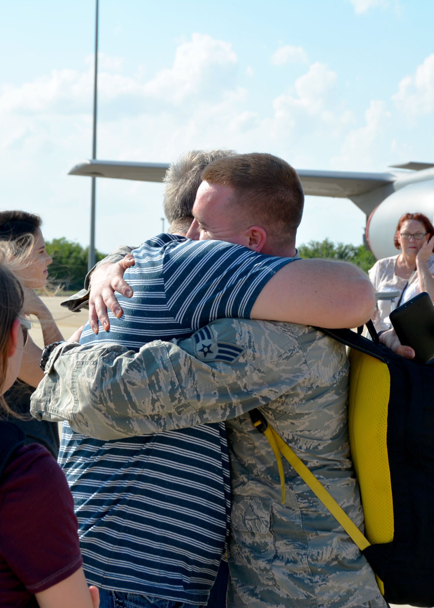 Senior Airman Joshua Hines of the 507th Aircraft Maintenance Squadron at Tinker Air Force Base, Okla., embraces his father June 11, 2016, following a four-month deployment to Southwest Asia. (U.S. Air Force photo/Tech. Sgt. Lauren Gleason)